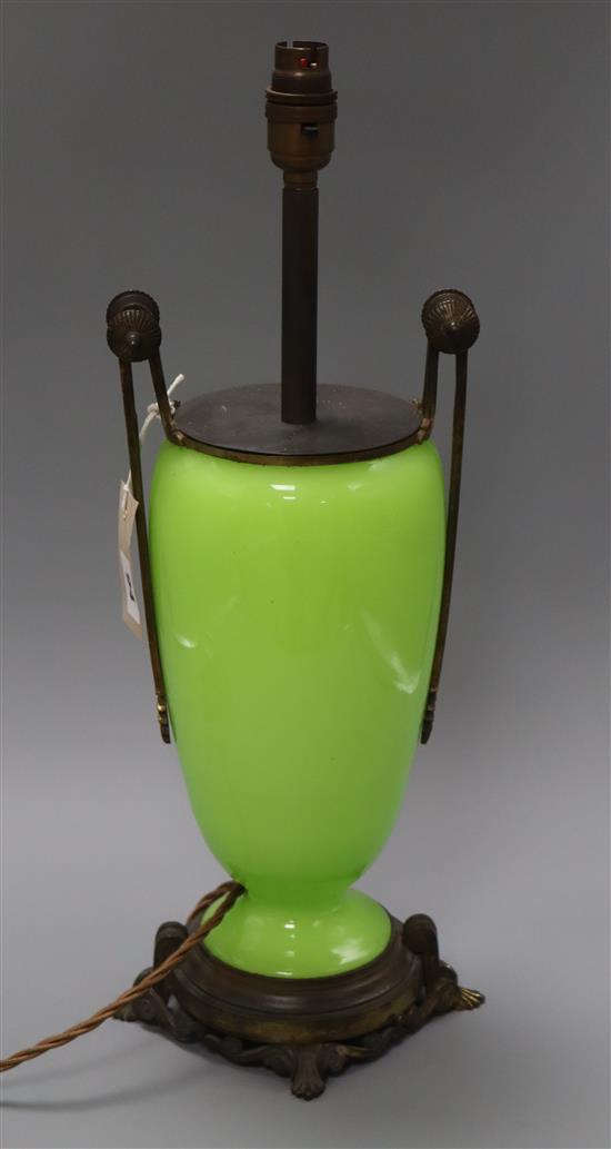 A gilt metal green glass table lamp